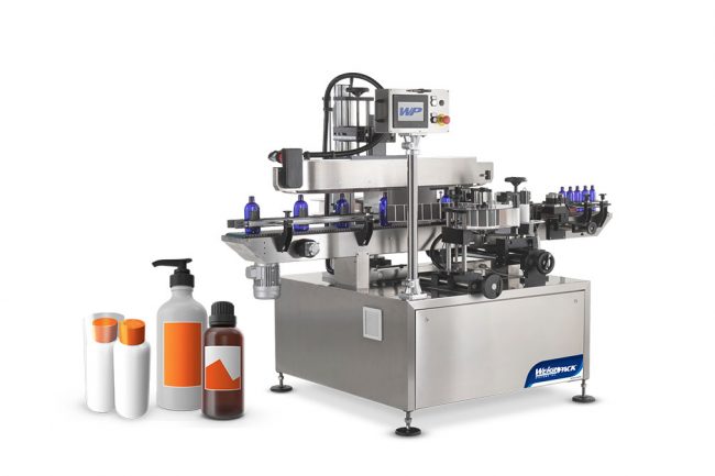 Bottle labeling and sleeving machine