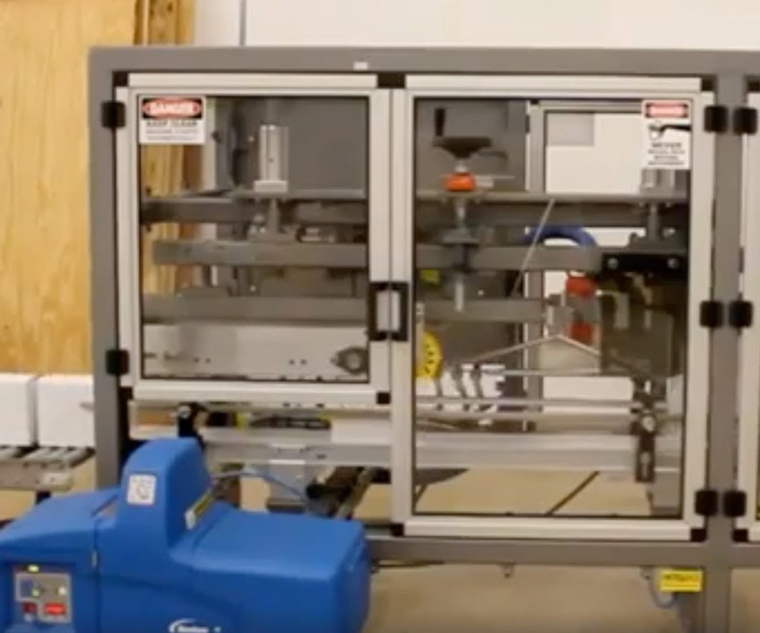 EZ Glue machine to close lids and glue seal retail cartons